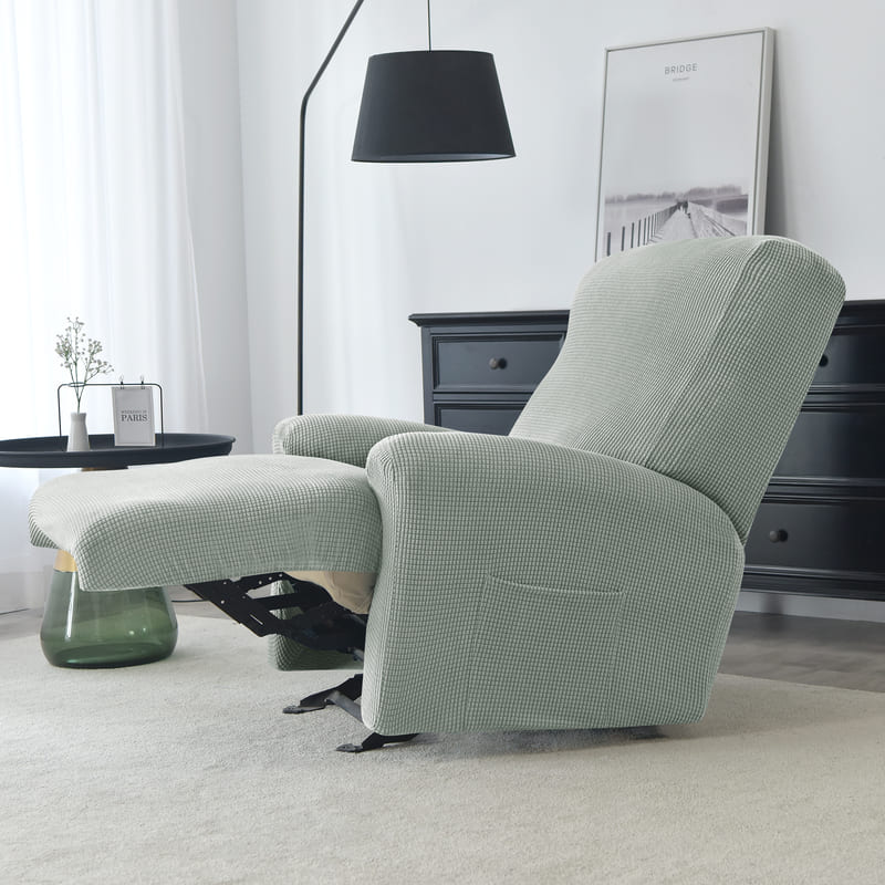 housse jacquard gris vert sur un fauteuil relax déplié