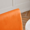 détail matière housse de chaise en simili cuir orange