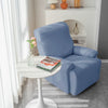 housse de fauteuil relax bleu gris près d&#39;une table basse