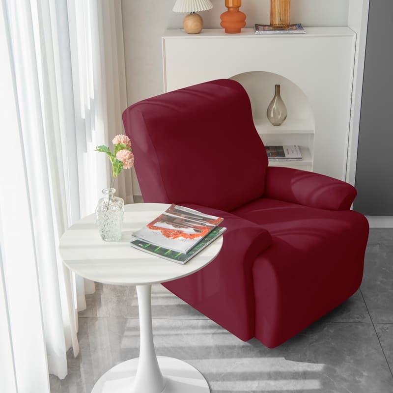 housse de fauteuil relax bordeaux près d&#39;une table basse