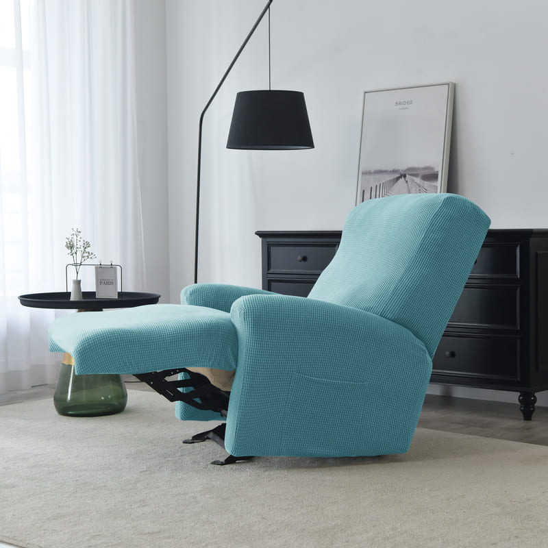 housse jacquard turquoise sur un fauteuil relax déplié