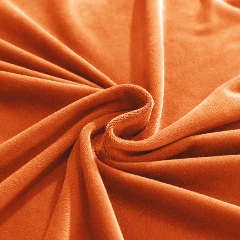 vue rapprochée du tissu de la housse de canapé d'angle velours orange